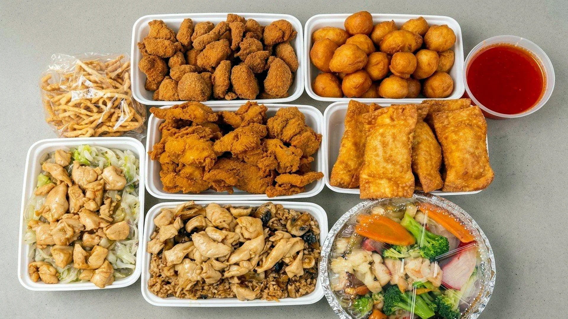 Family dinner for six: chicken balls, egg rolls, fried rice, chow mein and more